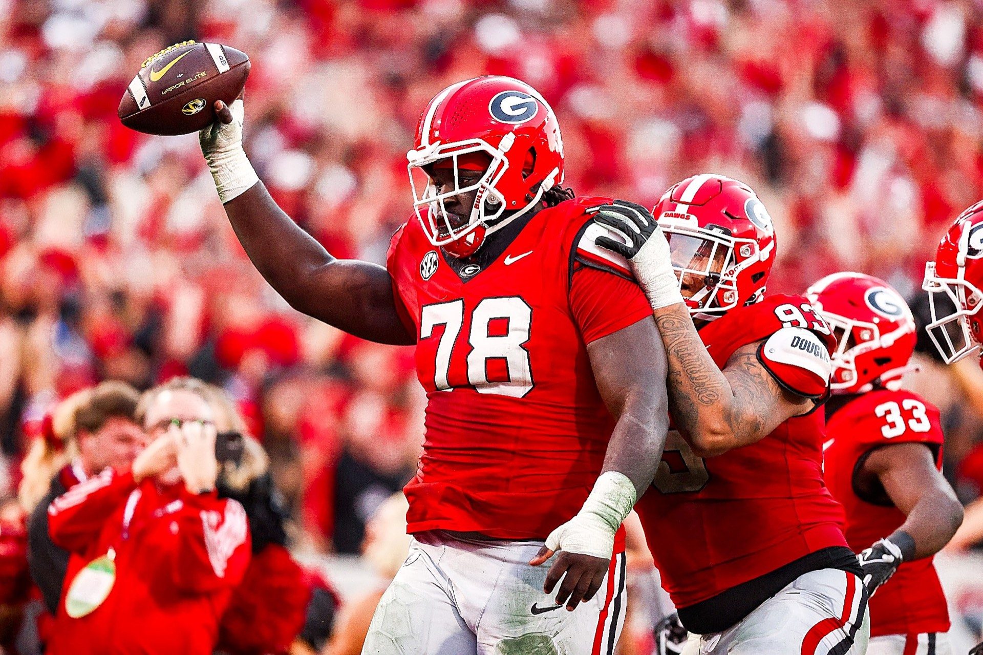 Georgia football players running during a game
