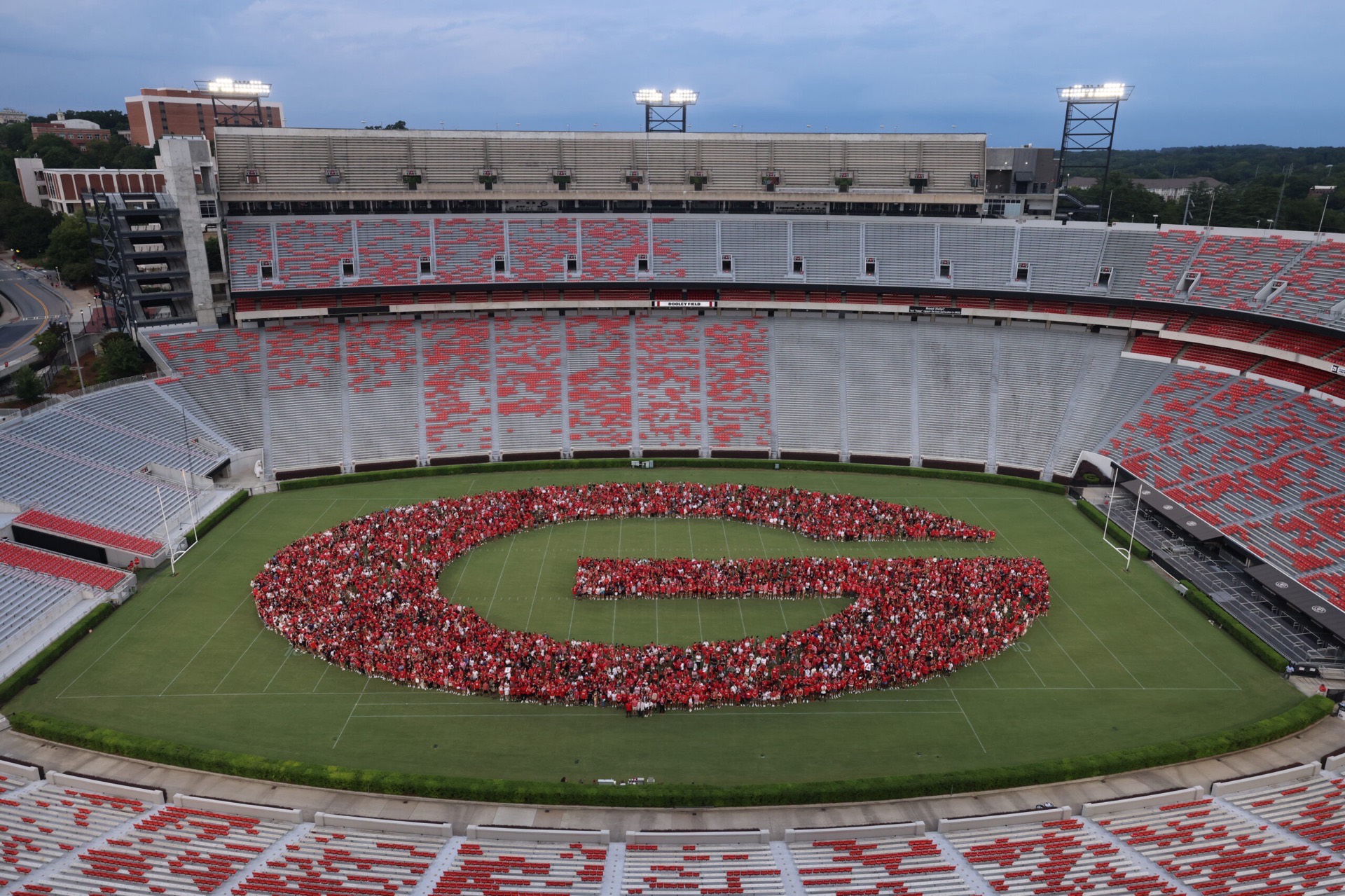 University of Georgia students forming the Georgia G on the field